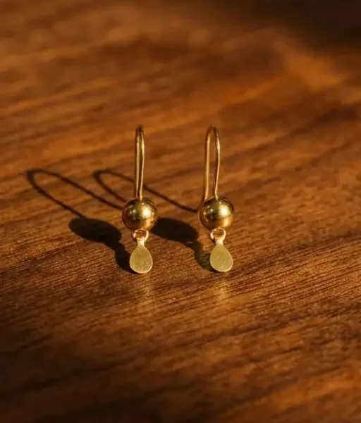 Elevate your everyday look with these stunning 18K gold-plated drop earrings. Whether it's a workday or a brunch date, these minimalist beauties add a touch of "#rich girl energy"#earrings, #Jhumka alternative, minimalist jewelry, Meesho finds, #daily wear jewelry